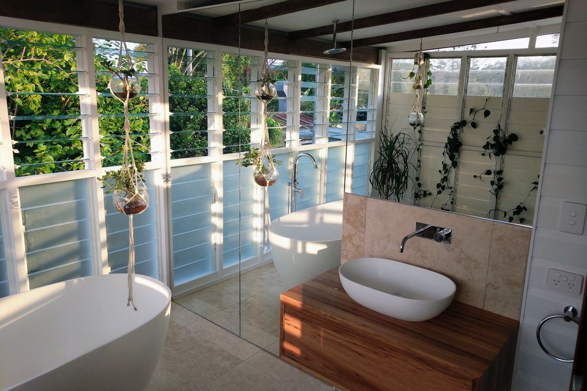 Frameless glass bathroom with mirrored recycled timber vanity Bangalow